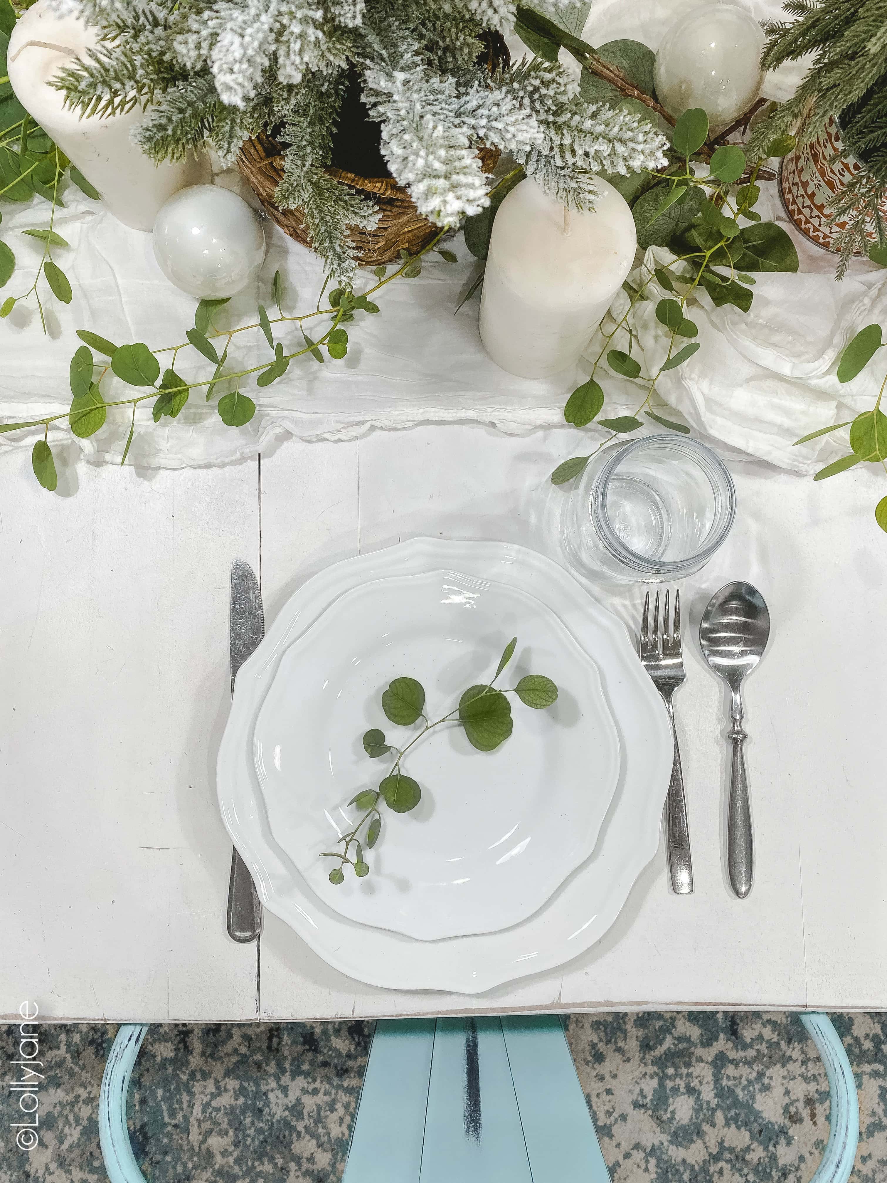 Spruce up your winter table with some fresh (or faux) eucalyptus branches and mini pine trees! #christmasdecor #christmasdecorations #christmascenterpiece #centerpiece #tablescape