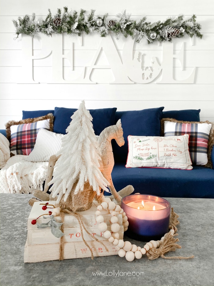 Learn how to make these DIY stamped books with few supplies! Such a fun handmade gift idea! Pretty farmhouse Christmas living room with easy to make accents! #diystampedbooks #stampedbooks #handmadegift #diygift #handmadegiftideas #diygiftideas #diystampedbooks