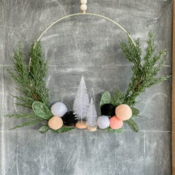 Loving this EASY to make holiday wreath... perfect for winter or Christmas. And SO affordable to copyat! #diy #christmasdecor #christmasdecorations #Christmaswreath #ChristmasDIY