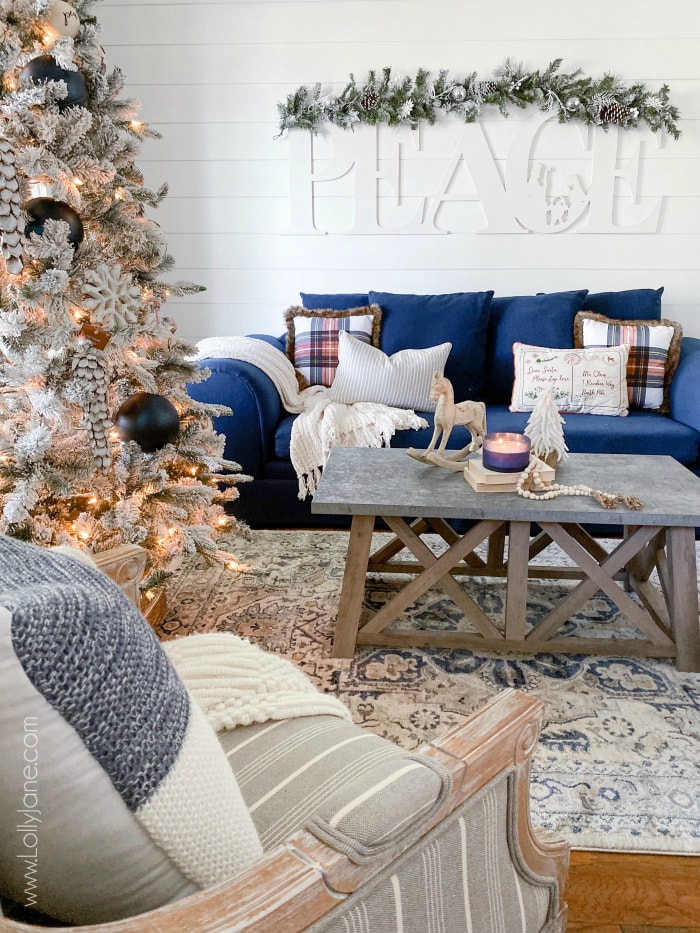 Love this cozy farmhouse Christmas living room! Follow these fun home decor bloggers to learn how to create a warm and inviting farmhouse Christmas your family can cuddle in all season long! #farmhousestyle #christmasdecor #farmhousechristmas #diychristmas #hygge