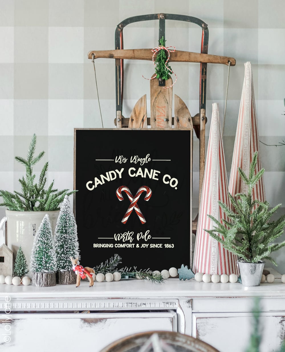 FREE Christmas Art, so cute!! Just print and display this darling "Kris Kringle Candy Cane Co." on your mantel, use as a card, or making into a bunting! #freeprintable #christmasdecor #christmasdecoration #candycane #christmasart #christmasprintable