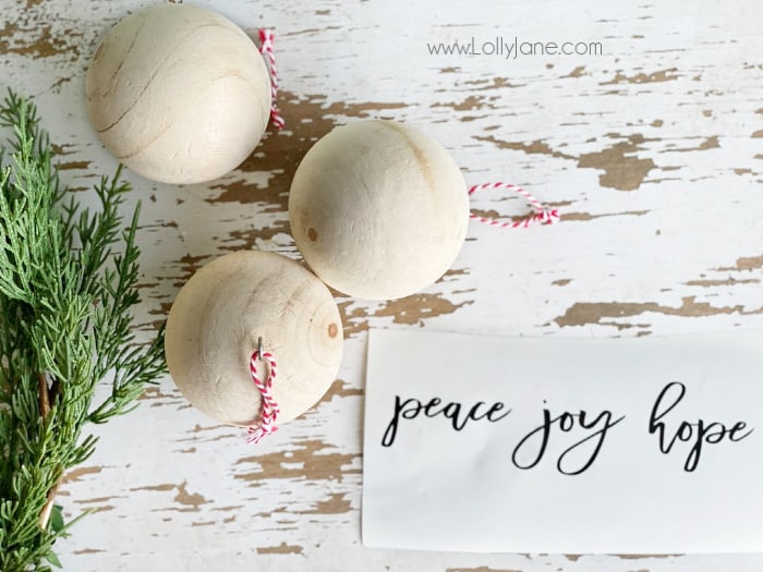 Check out these few supplies to make these easy script wood ball ornaments. Do you love handmade Christmas ornaments too? Check out this quick neutral Christmas tree decor! #farmhousechristmas #diyornament #handmadeornament #handmadeChristmas #easyChristmasdecor