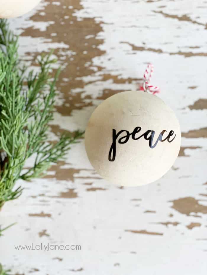 Easy wooden ball Christmas ornament DIY! Such a simple ornament to decorate a neutral tree or gift to a friend for the holidays. #diyornament #handmadeornament #farmhousechristmas #neutralchristmasdecor