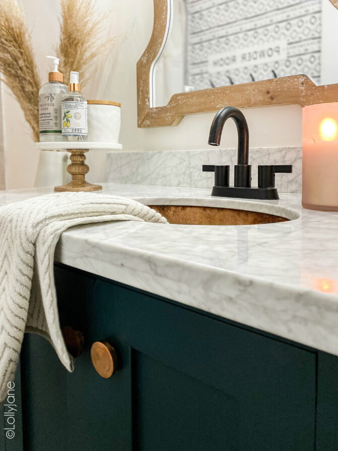 Love this Modern Farmhouse bathroom that has the right amount of touches of bohemian and tribal, so pretty! #modernfarmhouse #modernfarmhousebathroom #marbletile #subwaytile