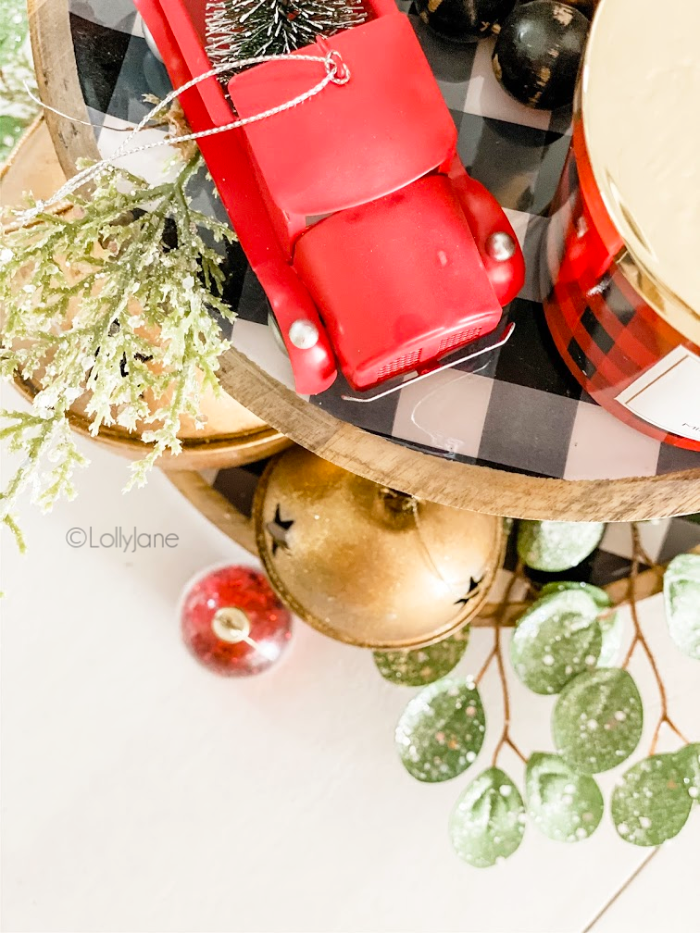 Check out these Christmas tiered tray ideas to create an easy holiday centerpiece with little effort! #christmasdecor #diychristmas #easychristmasdecor #christmastieredtray