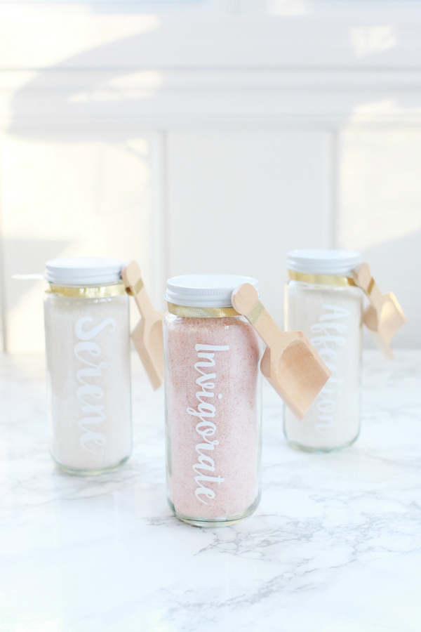 This is such an easy diy infused bath salts recipe. Package it in pretty glass containers for the perfect Galentines Day gift! #giftidea #handmadegifts #handmadegiftidea #bathsaltsrecipe #infusedbathsalts