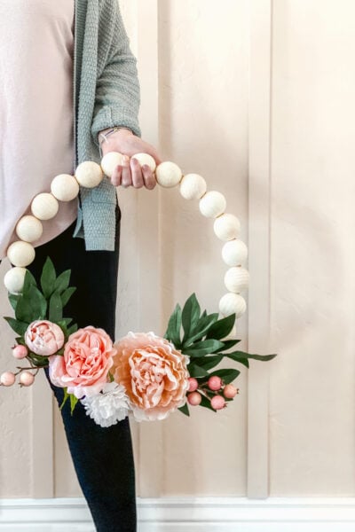 Wood Bead Wreath with Florals that perfect for spring or any time of year! EASY to make for DIYers of any level, click through for the simple how-to! #wreath #wreathdiy #diywreath #springwreath #wreathsofinstagram #diyspringdecor #springdecor #woodbeadwreath