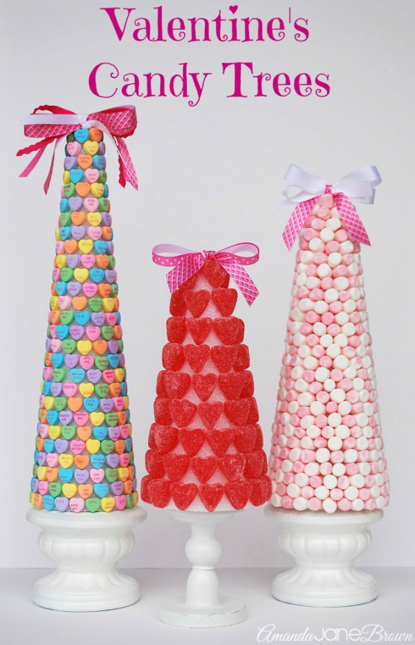 Make these Dollar Store Valentines Day Candy Trees with a styrofoam cones, candies and hot glue! Such an easy and affordable Valentines Day craft idea!! #dollarstorecraft #dollarstoredecor #valentinesdaydecor #valentinesdaycandytree #diycandytree