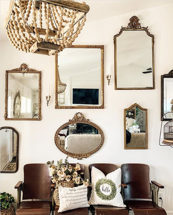 Add a grouping of gold mirrors to an entryway wall surrounding a bench for easy wall treatment ideas. #mirrorgallerywall #gallerywalldecor #mirrorgallerywall #mirrorgallerywalldecor 