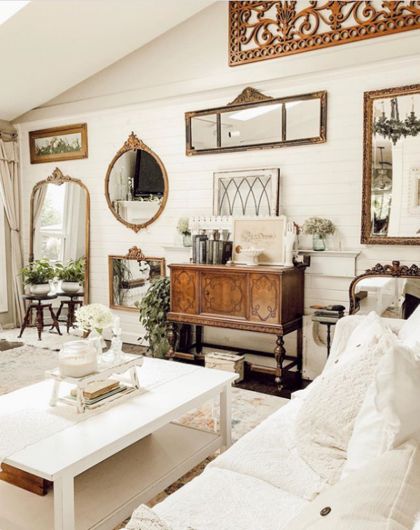 Check out this mirror gallery wall family room decor, so pretty! Add mirrors and frames to fill a large wall! #farmhousefamilyroomdecor #mirrorgallerywall #mirrorwall #hangingmirrorideas #mirrorgallerywallideas #farmhousemirrorcollection