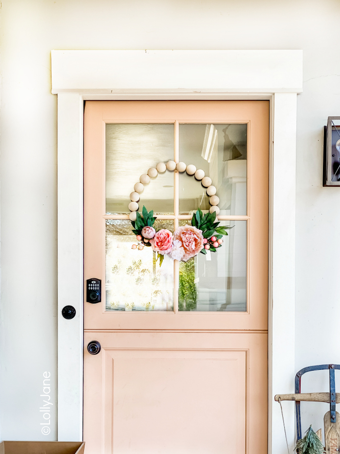 How to make a wood bead wreath, perfect for your front door wreath! Follow these easy tips to create a trendy wreath idea! #woodbeadwreath #woodbeadfloralwreath #howtomake woodbeadwreath #woodenbeadwreath