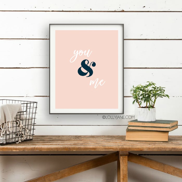 You and Me printable art! Love this simple Valentines Day print for an easy wall treatment! Looking for easy Valentines Day decorations? Save and print this pink you and me Valentine's Day printable art! #valentinesdaydecor #loveprint #allyouneedislove #allyouneedisloveprint #printableart #vdayart 