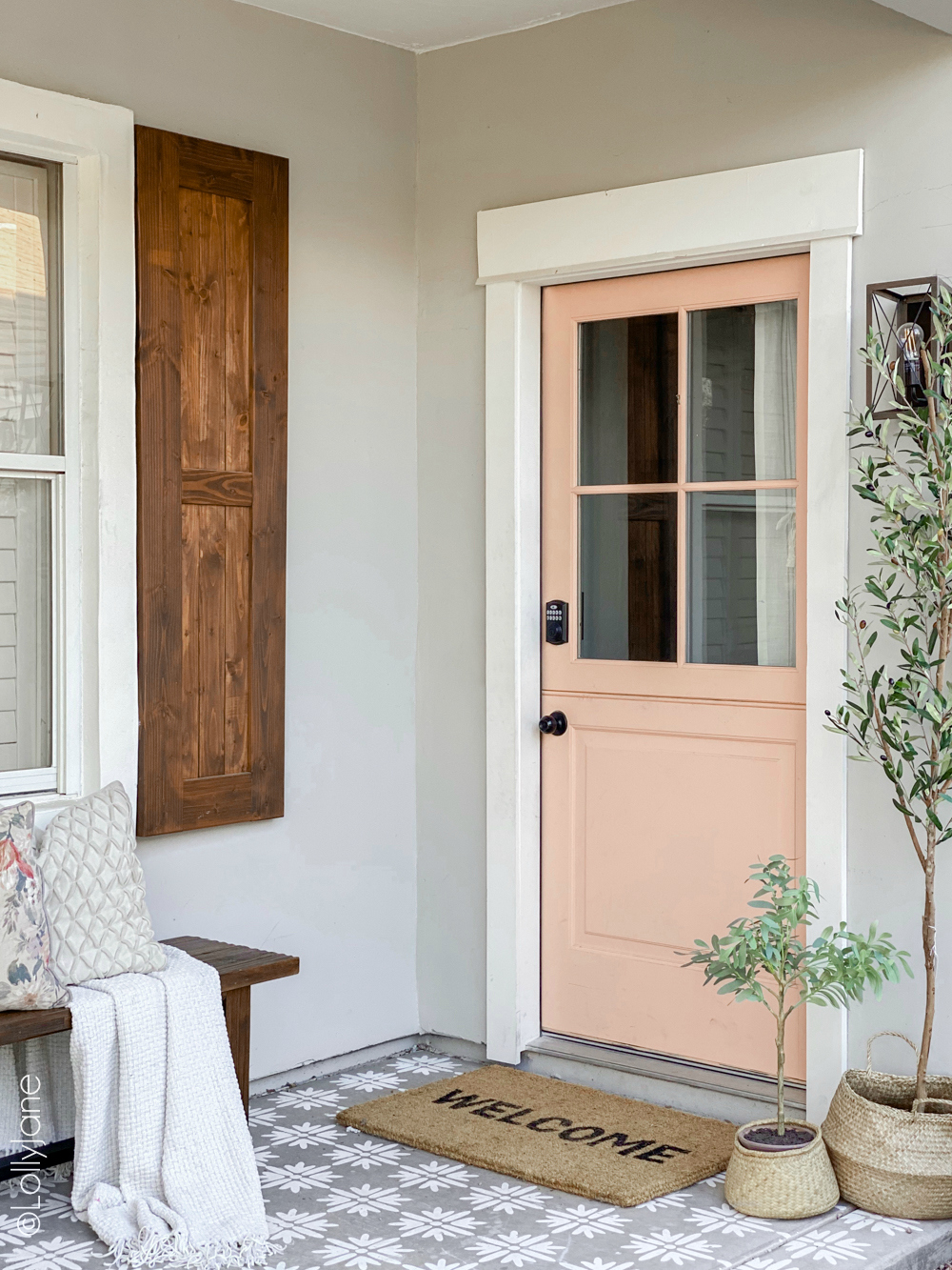 Classic craftsman style home with a pop of pink, so good! GORGEOUS Front Porch Makeover, check out the before-- WOW! #diy #stencil #Dutchdoor #pinkdoor #makeover #porchdecor #porchmakeover