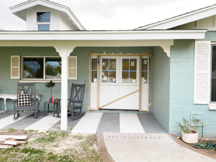 Loving these dutch doors on this old farmhouse, they look so nice with the new board and batten dormers. Love these custom dutch doors on this farmhouse home. #farmhousehome #customdutchdoors #dutchdoorinstallation #doubledutchdoors