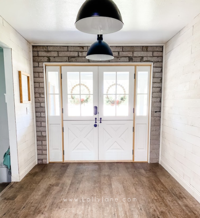 Loving our custom farmhouse dutch doors. They make such a statement with the matching farmhouse sidelights. #customfrontdoors #dutchdoors #doubledutchdoors #farmhousedoors #farmhousestyledoors