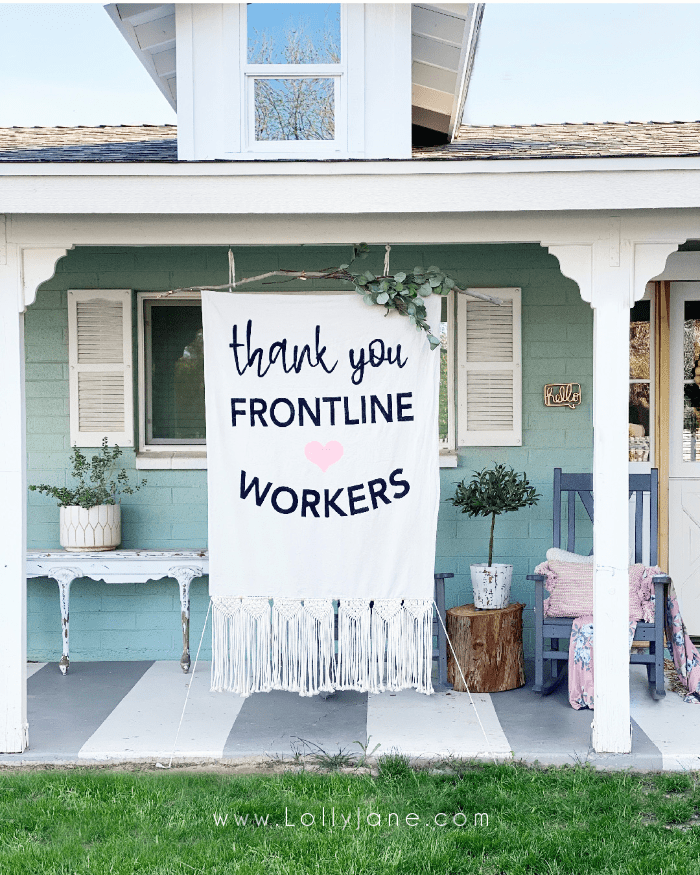 Do you have an unused drop cloth laying around? We turned a scrap piece into a huge banner, free! Just use paint and a few things on hand to create a large boho banner drop cloth, endless possibilites! #diynosewbanner #dropclothbanner #howtomakedropclothbanner #bohobanner #eucalyptusbanner