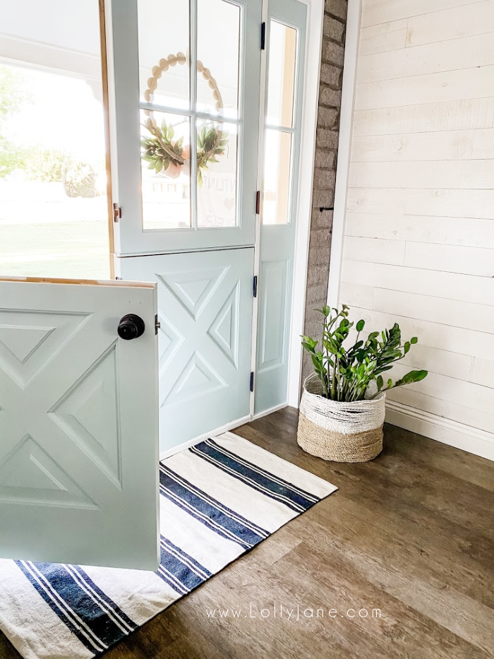 In love with these custom interior double dutch doors. The prettiest blue dutch doors that offer a farmhouse vibe. #dutchdoor #doubledutchdoors #frenchdutchdoors #farmhousedutchdoors #dutchdoor #simpsondutchdoor