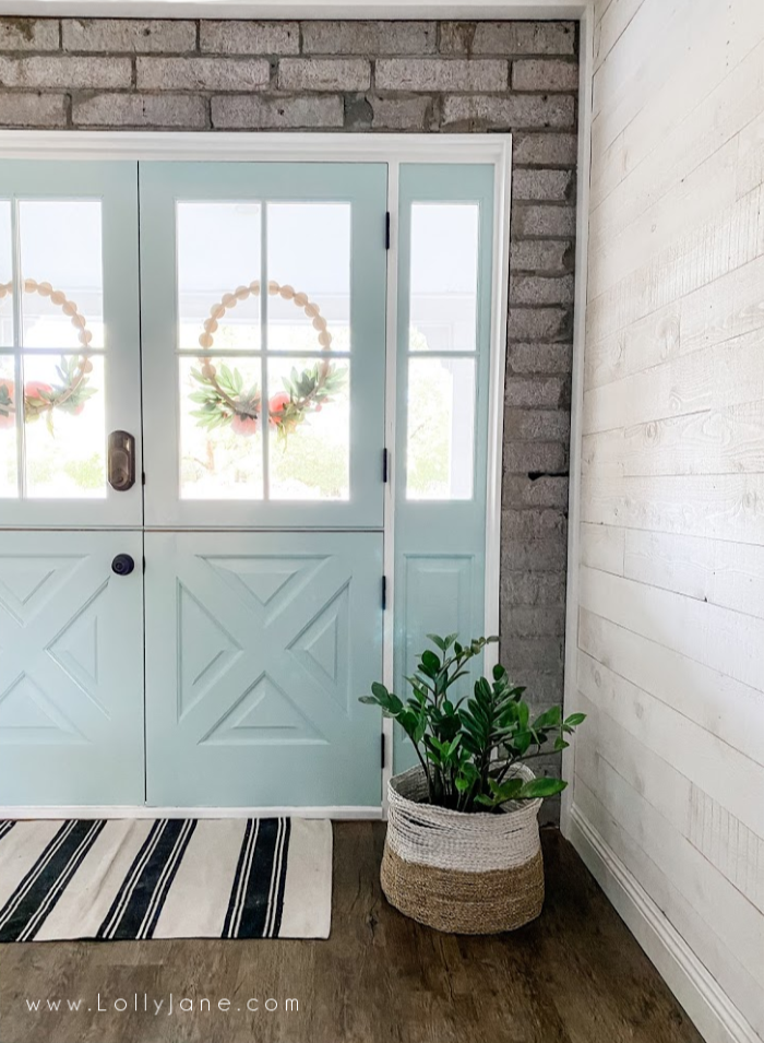 Love these painted doors in the color Natures Refection from Behr. Such pretty painted blue dutch doors. #dutchdoors #doubledutchdoors #frenchdutchdoors #howtoinstalldutchdoors #bluedutchdoors #farmhousedutchdoors