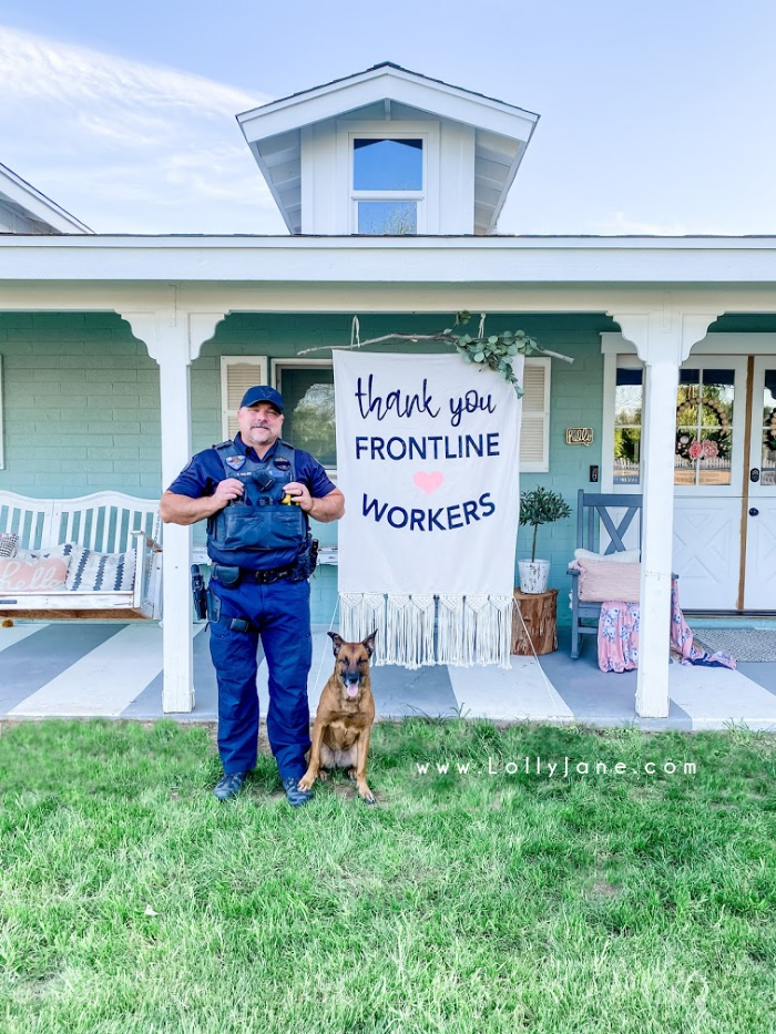 DIY sign to thank frontline workers. Show essential workers you can with an easy to make no sew boho banner from a drop cloth! Love this original idea using fringe on a drop cloth for an easy to create thank you banner! #nosewbanner #frontlineworker #essentialworkers #thankyousign #diynosewbanner #dropclothbanner #howtomakedropclothbanner #bohobanner