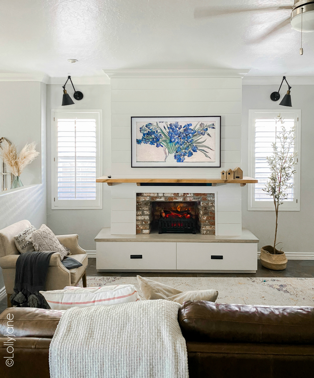 Beautiful modern farmhouse style entertainment system... bet you thought this was a real fireplace! Look at these 5 secret built-in features! #modernfarmhouse #fauxfireplace #entertainmentsystem #diy #diyhomedecor