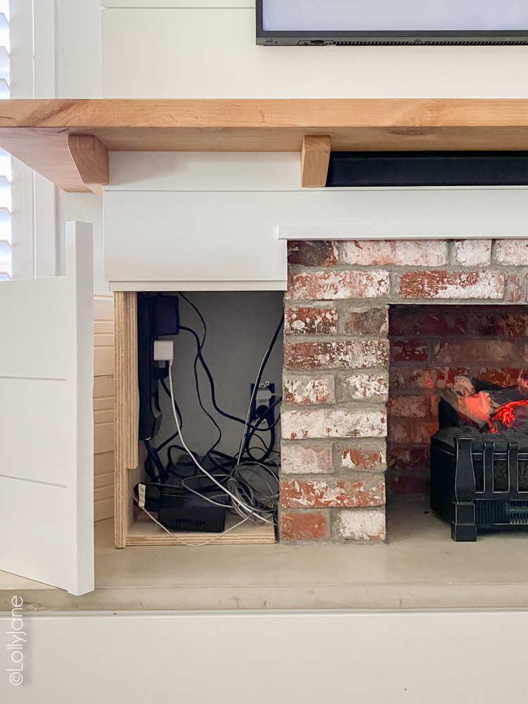 Stunning DIY Entertainment Center with 5 hidden design features that hide clutter and cords but make a BIGG statement! #modernfarmhouse #fauxfireplace #entertainmentsystem #diy #diyhomedecor