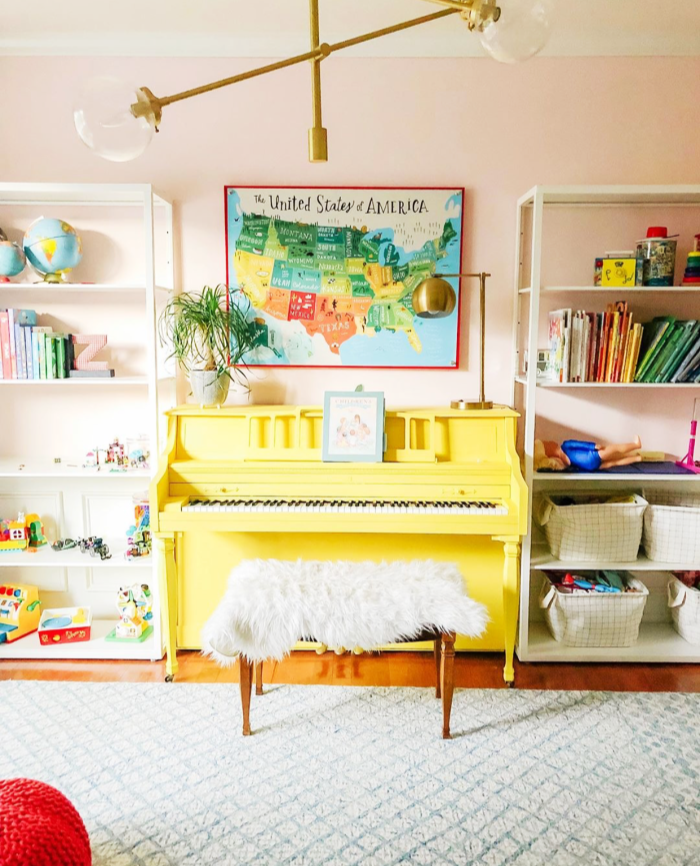 What is more cheerful than a happy yellow painted piano? We're loving this ray of sunshine! #paintedpiano #yellowpaintedpiano #paintedpianoideas #eclecticdecor #howtodecoratearoundapiano