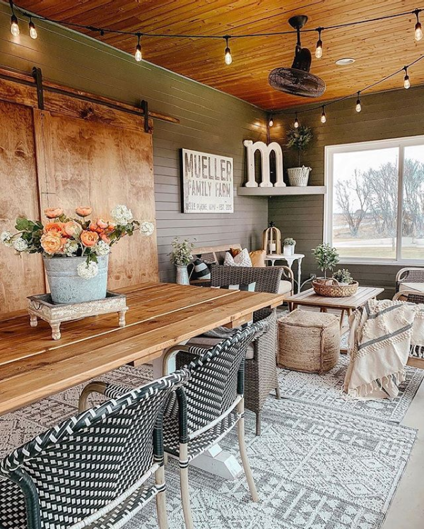 So in love with this farmhouse sunroom. It's the perfect spot to gather family on this beautiful outdoor rug. #farmhouserug #modernfarmhouserug #cozyoutdoorspaces #outdoorrug #farmhosueoutdoorrug #sunroomdecorideas