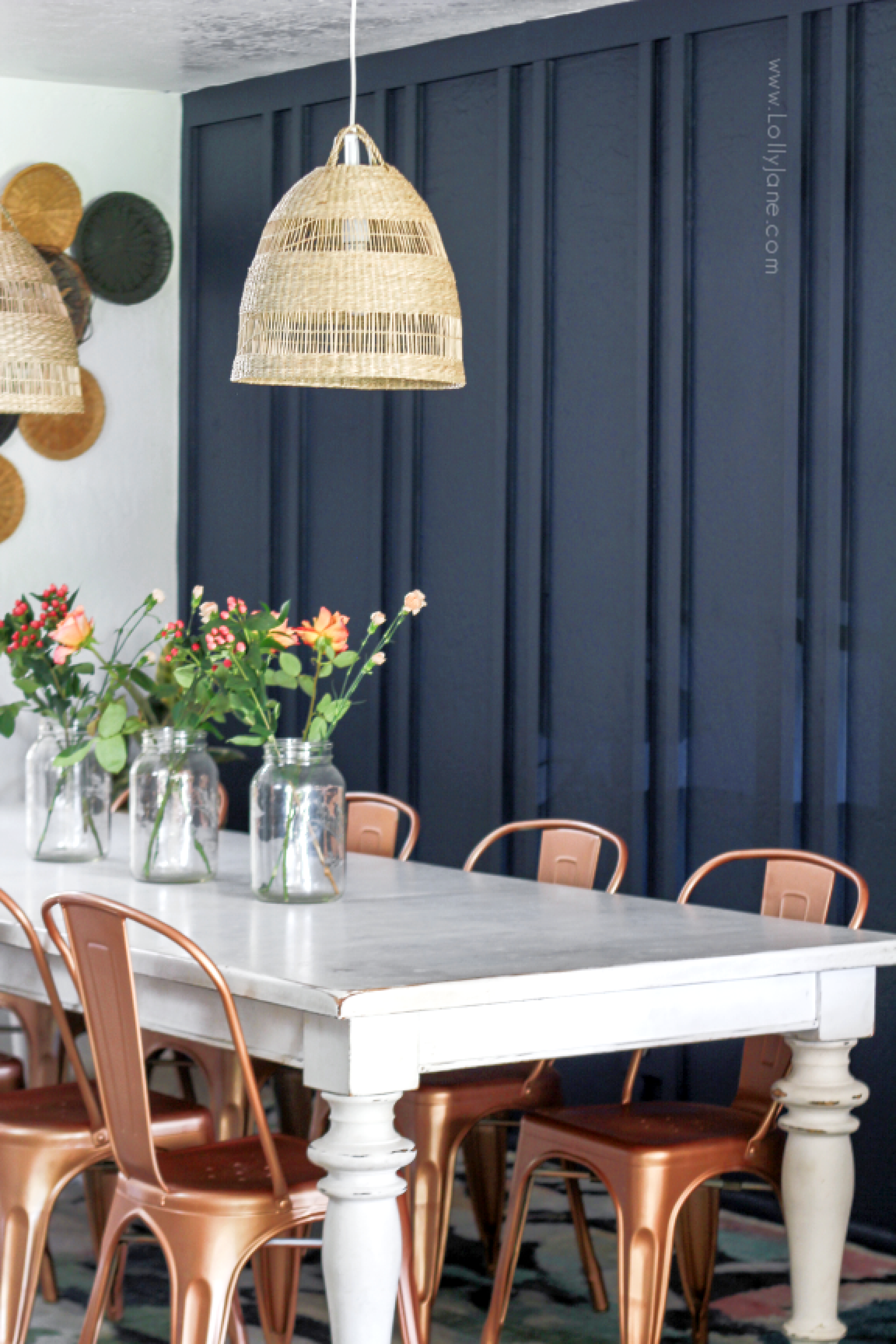 Are you looking for ways to decorate your dining room with a boho style? Get ideas for modern minimalist furnishings and decorative accents on a budget! #bohostyledecor #bohodiningroom #navydiningroom #boardbattendiningroom #doublebatten #walltreatmentdiy #diywalltreatment #diyboardbatten