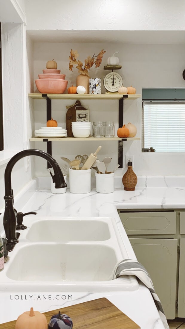 Learn how to install open kitchen shelves in just a few minutes! These black brackets are modern but cozy for any decor. Just anchor and screw in, holds 200 lbs so they're heavy duty enough for tons of dishes but we like them for everyday dishes on the bottom and seasonal decor on top! #openkitchenshelves #kitchenopenshelves #howtoinstallopenshelves #howtoinstallshelves #blackmodernbracket #modernfarmhousebrackets #metalbrackets #diyshelves #easytoinstallshelves