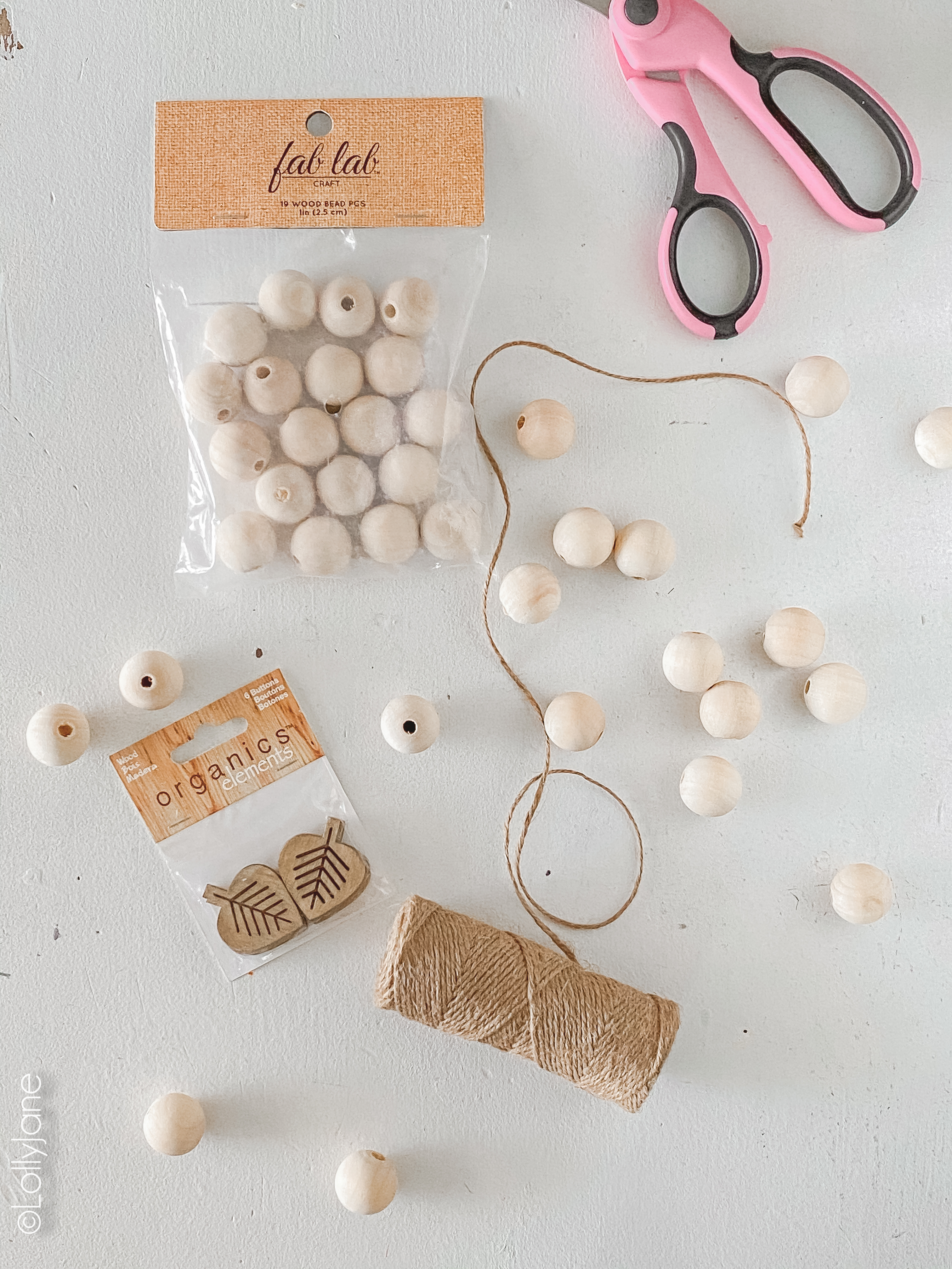 Supplies for a DIY Fall Wood Bead Garland... so easy to make and PERFECT for fall! #fall #falldecor #leaftcraft #fallcraft #fallhhomedecor #diy #diyfalldecor #falldecorations