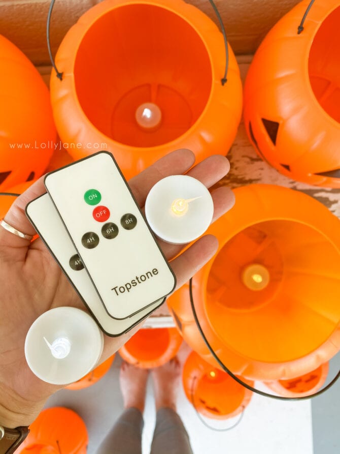 Add remote control tea lights as Halloween pumpkin filler to light it up. SO cute and saves so much time from turning them on manually! #besttealights #batteryoperatedtealights #remotecontroltealights #ledtealights #howtolightuppumpkins #besttealightsforjackolanterns #tealightpumpkins #halloweenoutdoordecor #outdoorhalloweendecor #halloweenporchdecor #halloweendecorationsoutdoors