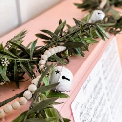 Easy peasy Christmas garland with just 3 items! The jingle bells are the perfect touch for Christmas! #diy #garland #christmasgarland #beadgarland #woodbeadgarland #christmasdiy #christmasdecor #christmasdecoration #handmade #jinglebell
