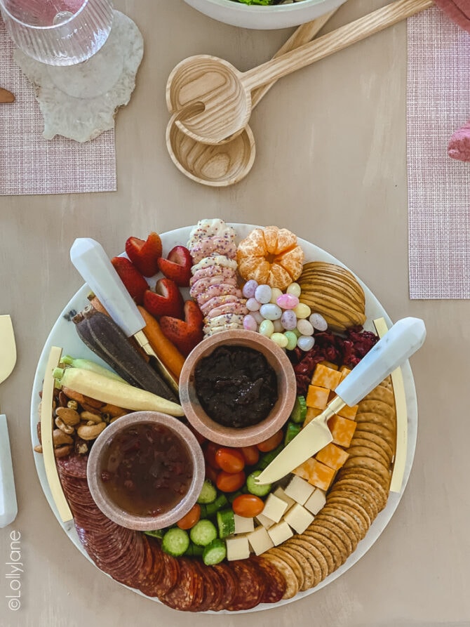 Easy to copy Easter style charcuterie board that's perfect for snacking at your Easter brunch! Love the marble and gold tray, so pretty! #easter #easterdecor #easterdecorations #eastertablecape #springtablescape #tablescape #tabledecor #eastertabledecor #charcuterieboard #eastercharccuterieboard