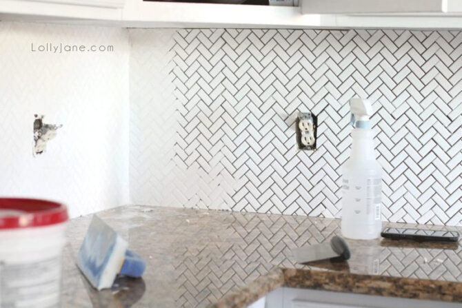 Consider white grout when installing white herringbone for a kitchen backsplash. Such a classic white kitchen that will last for years to come.