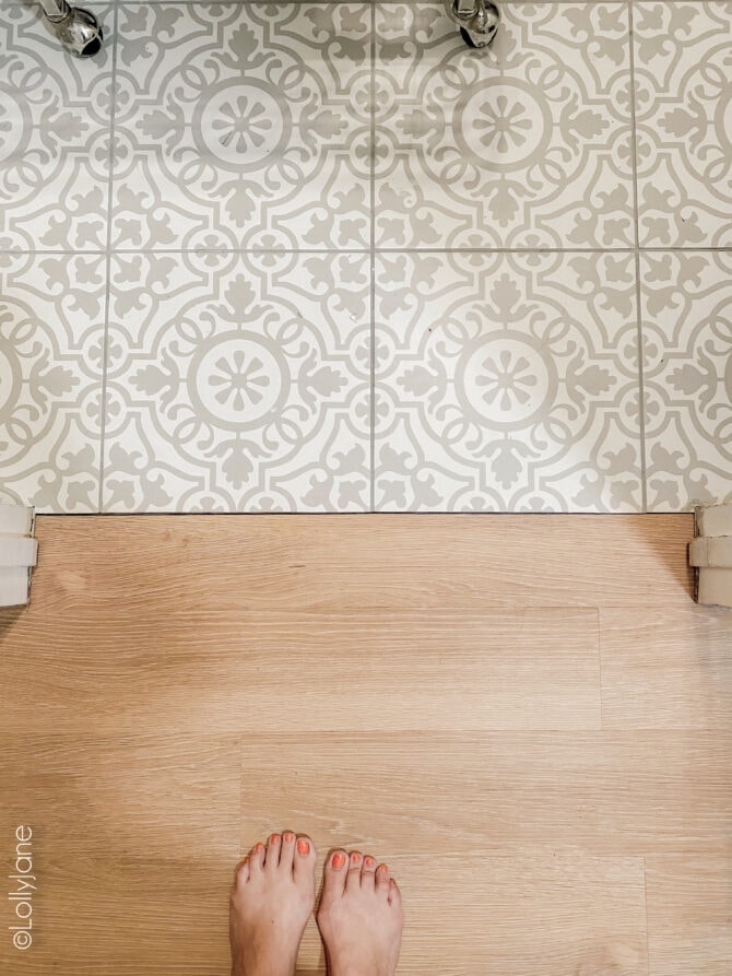 Love the combo of this mosaic laundry room meets warm oak LVP floor... can't believe that's not real hardwood! WOW!