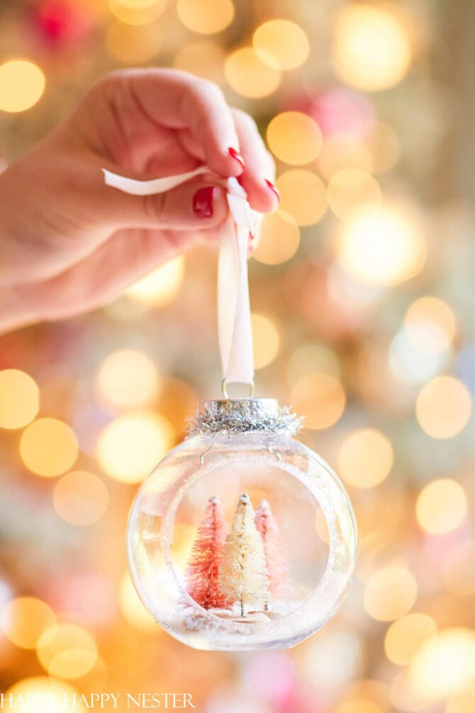 These DIY Christmas Diorama Ornaments are easy to make with mini bottle brush trees. So cute and festive!