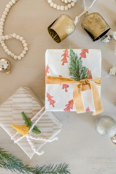 In a pinch for festive gift wrap? Grab a potato and some paint to make a festive design in no time... on the backside of ANY type of wrapping paper!