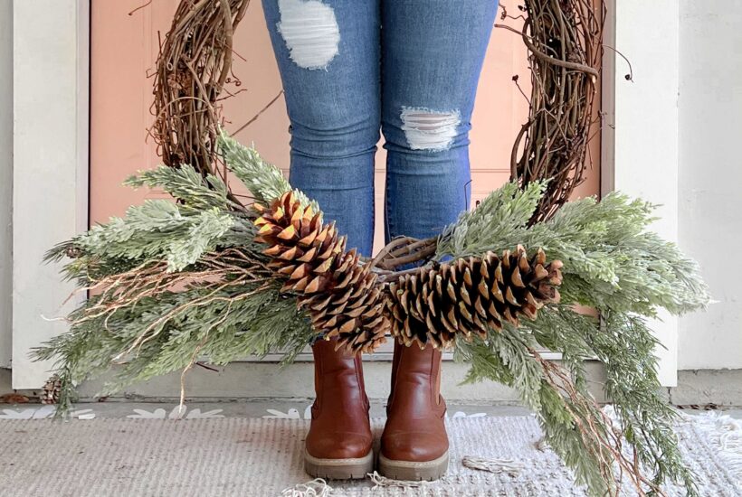 An easy pinecone grapevine wreath using a few picks of greenery, large pinecones and wood branches. Love this easy winter wreath!