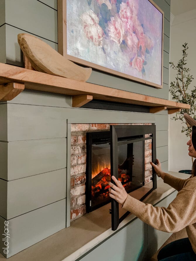 DIY built-in fireplace, so affordable and cozy! What a highlight to the rooms esthetic!