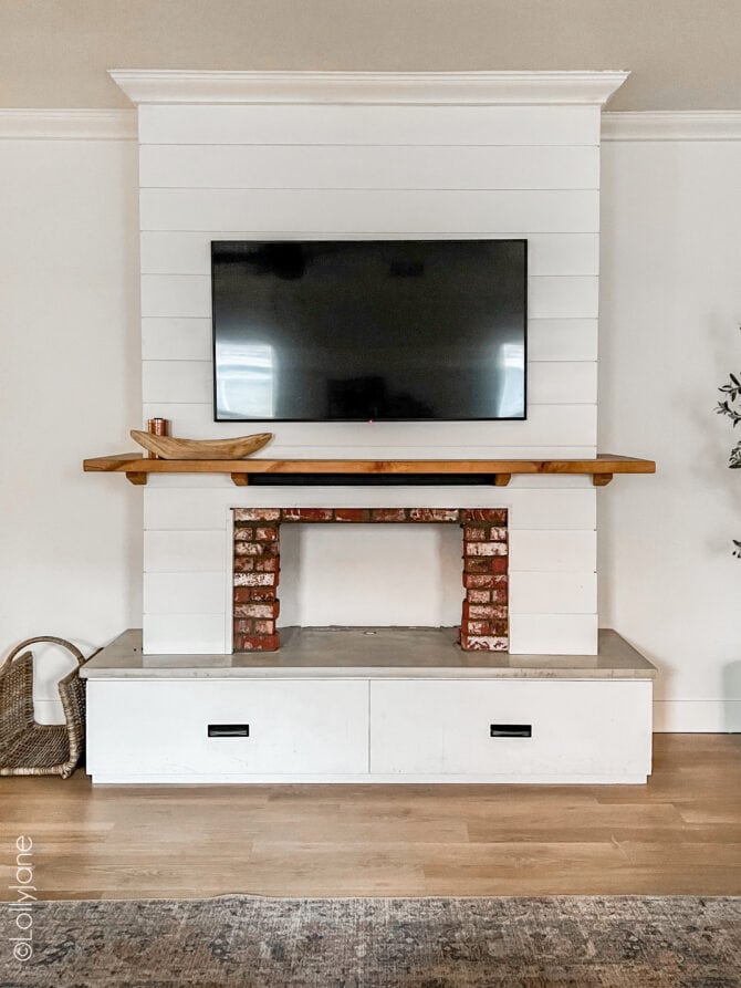 Add an electric fireplace insert to this DIY Entertainment System for INSTANT ambience!