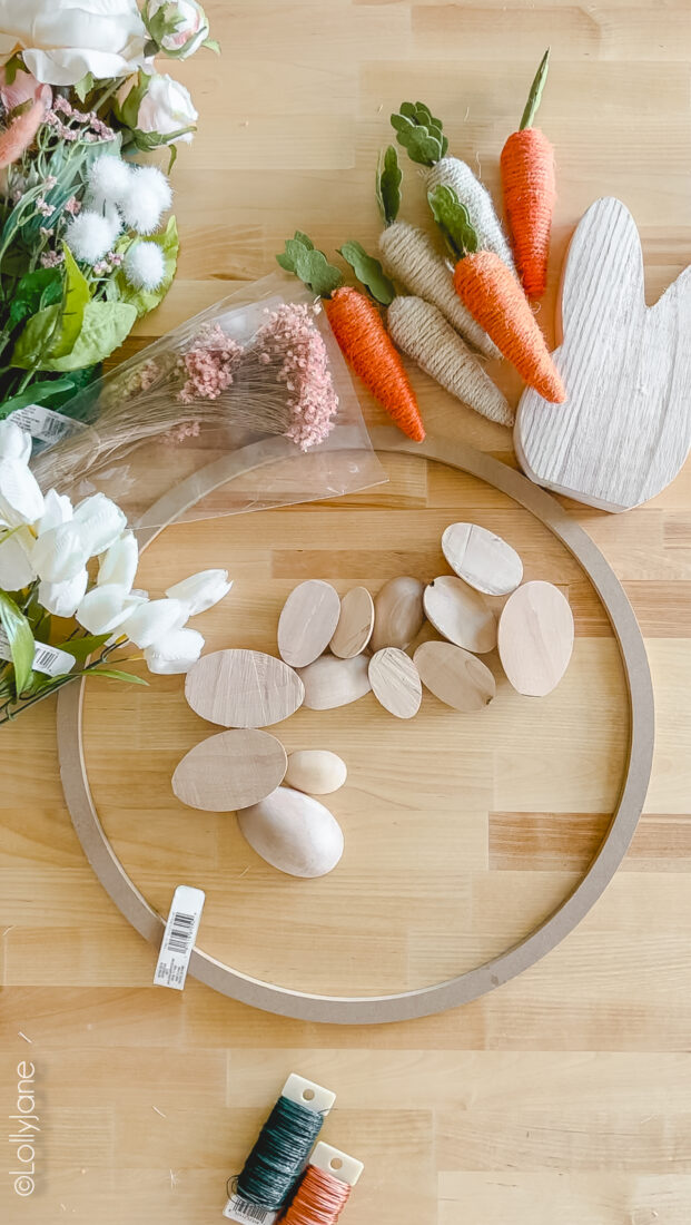Supplies to make an easy DIY Easter Wreath. Wood eggs, florals and ribbon? Yes please!