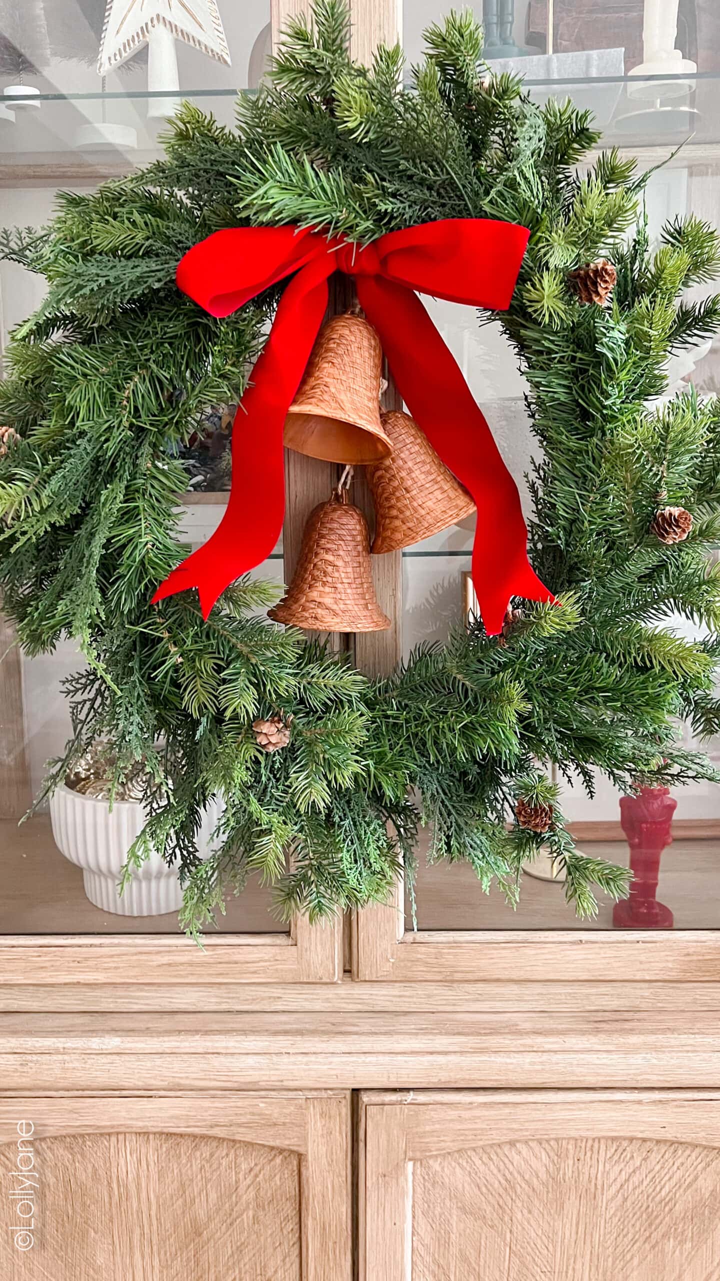DIY Christmas Wreath using Rattan Bell Ornaments. Stay on budget AND in style with this swap for brass bells!