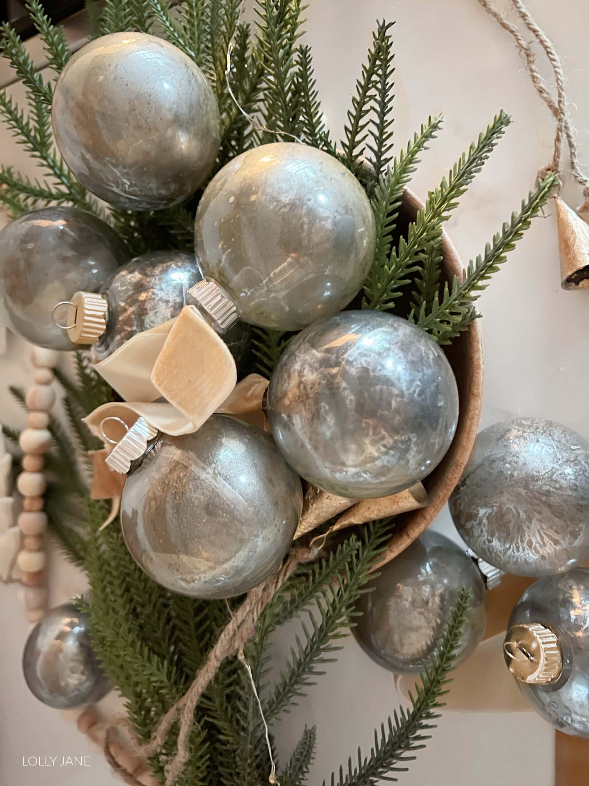 Make your own mercury glass ornaments in no time and with just a few supplies! Stunning on a tree or as a centerpiece!