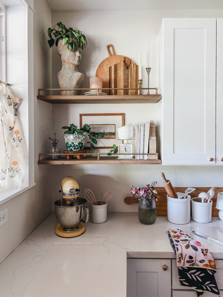 Learn how to create heavy-duty DIY floating shelves in a pretty white kitchen with our easy-to-follow tutorial, perfect for beginners using wood shelves.
