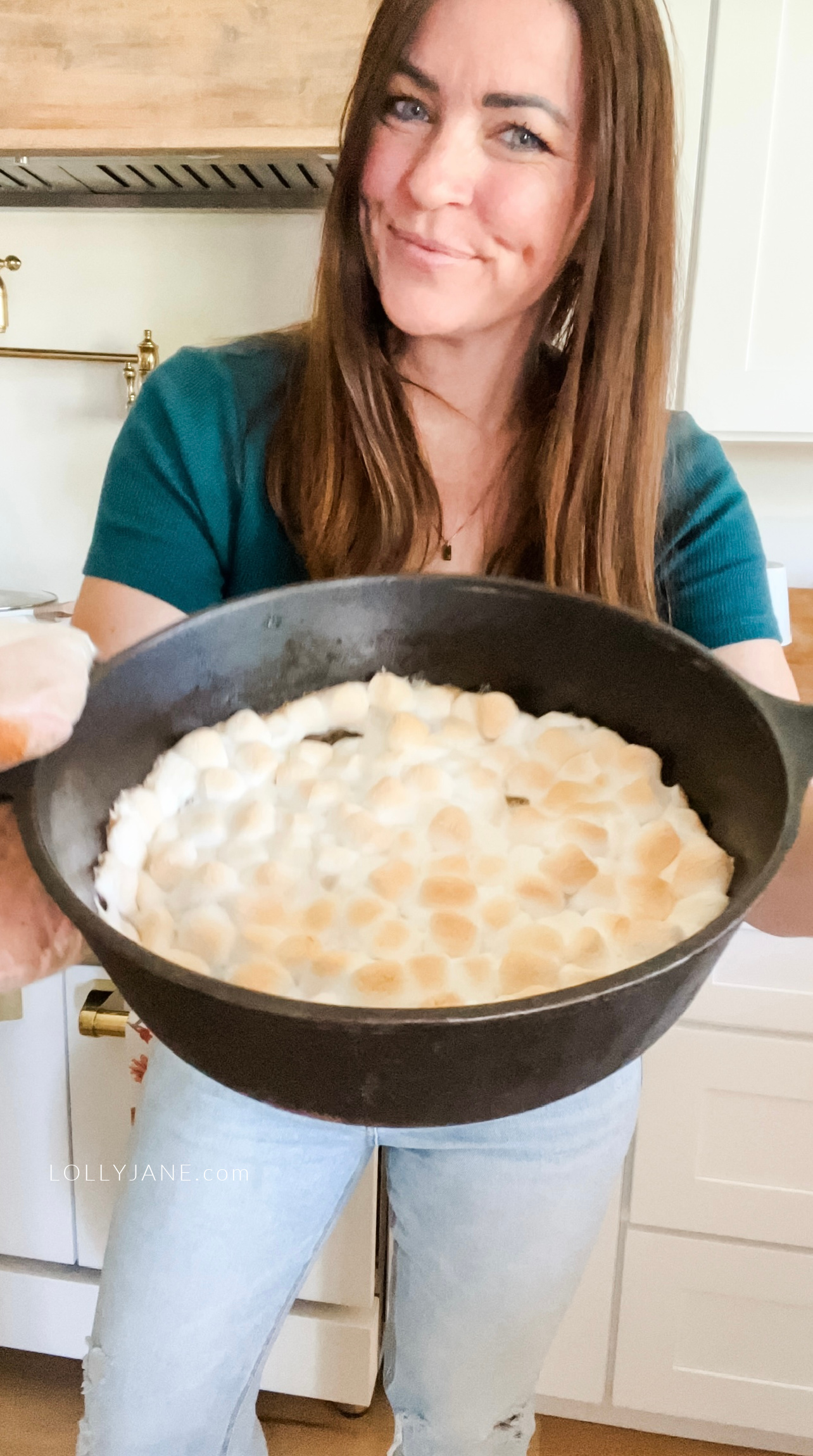 This s'mores dip, baked to toasted perfection in a cast iron skillet, is loaded with melted milk chocolate and marshmallows. Serve with graham crackers for dipping.