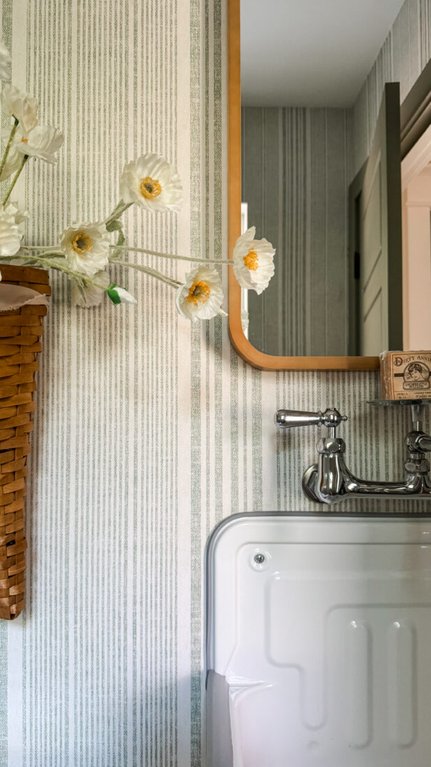 Powder room restyle with matching painted trim and door.