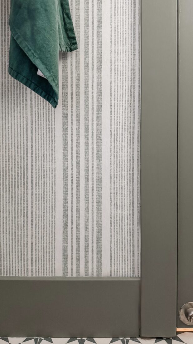 Bathroom quick refresh with peel-and-stick wallpaper accent wall.