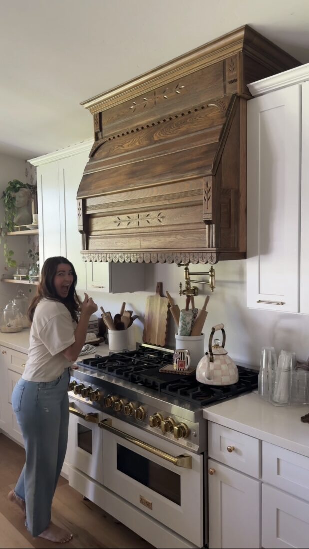 Finished kitchen renovation with antique headboard hood and wallpaper