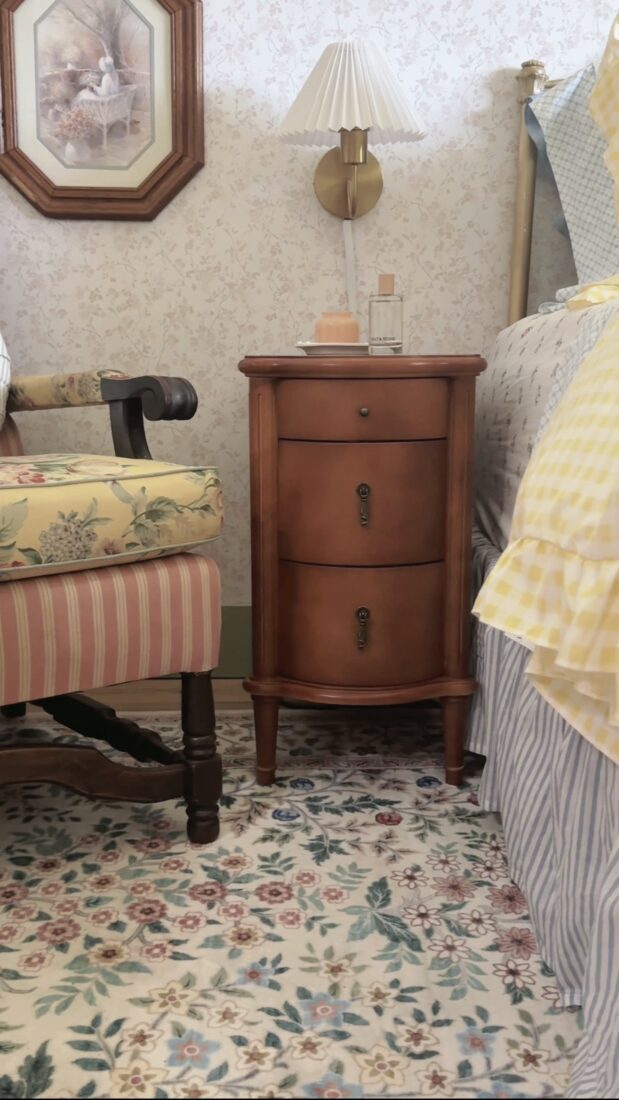 Slim charging nightstands beside a queen bed in a small guest bedroom